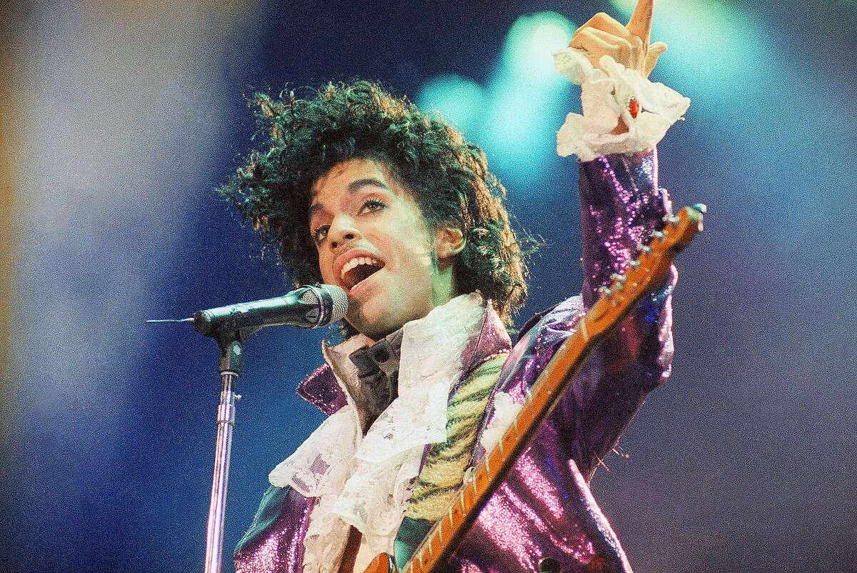 FILE - In this Feb. 18, 1985 file photo, Prince performs at the Forum in Inglewood, Calif. Prince, widely acclaimed as one of the most inventive and influential musicians of his era with hits including "Little Red Corvette," ''Let's Go Crazy" and "When Doves Cry," was found dead at his home on Thursday, April 21, 2016, in suburban Minneapolis, according to his publicist. He was 57. (AP Photo/Liu Heung Shing, File)