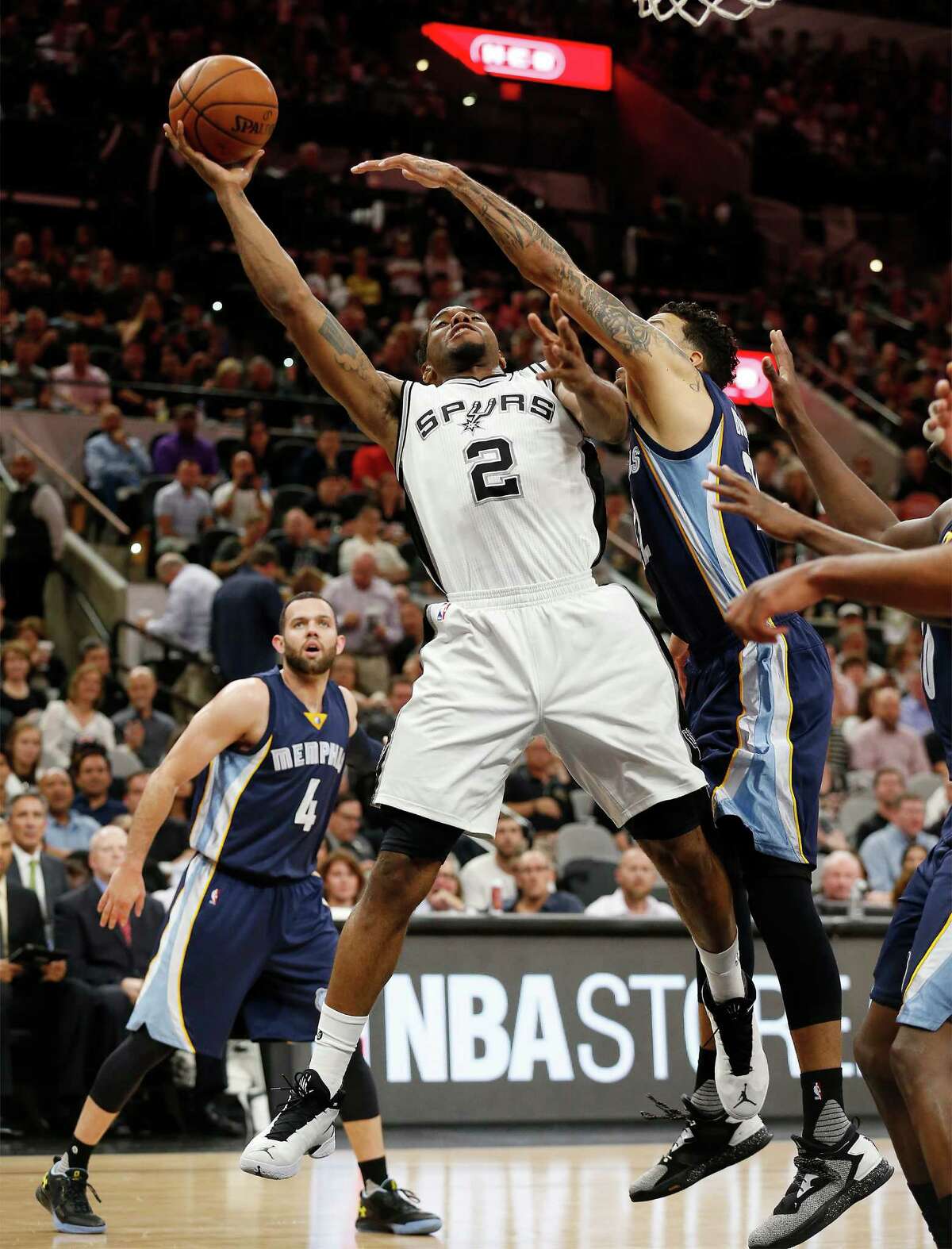 Spurs's Kawhi Leonard (02) goes for a shot against Memphis Grizzlies' Matt Barnes (22) at the AT&T Center in Game 2 of the first round of Western Conference playoffs on Tuesday, Apr. 19, 2016. (Kin Man Hui/San Antonio Express-News)