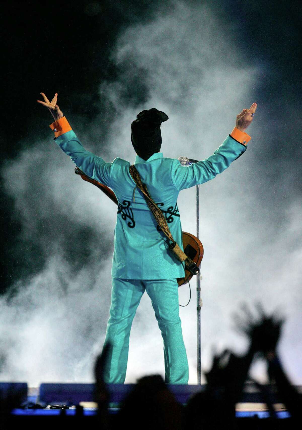 FILE - In this Feb. 4, 2007 file photo, Prince performs during the halftime show at Super Bowl XLI at Dolphin Stadium in Miami. Prince's publicist has confirmed that Prince died at his home in Minnesota, Thursday, April 21, 2016. He was 57.