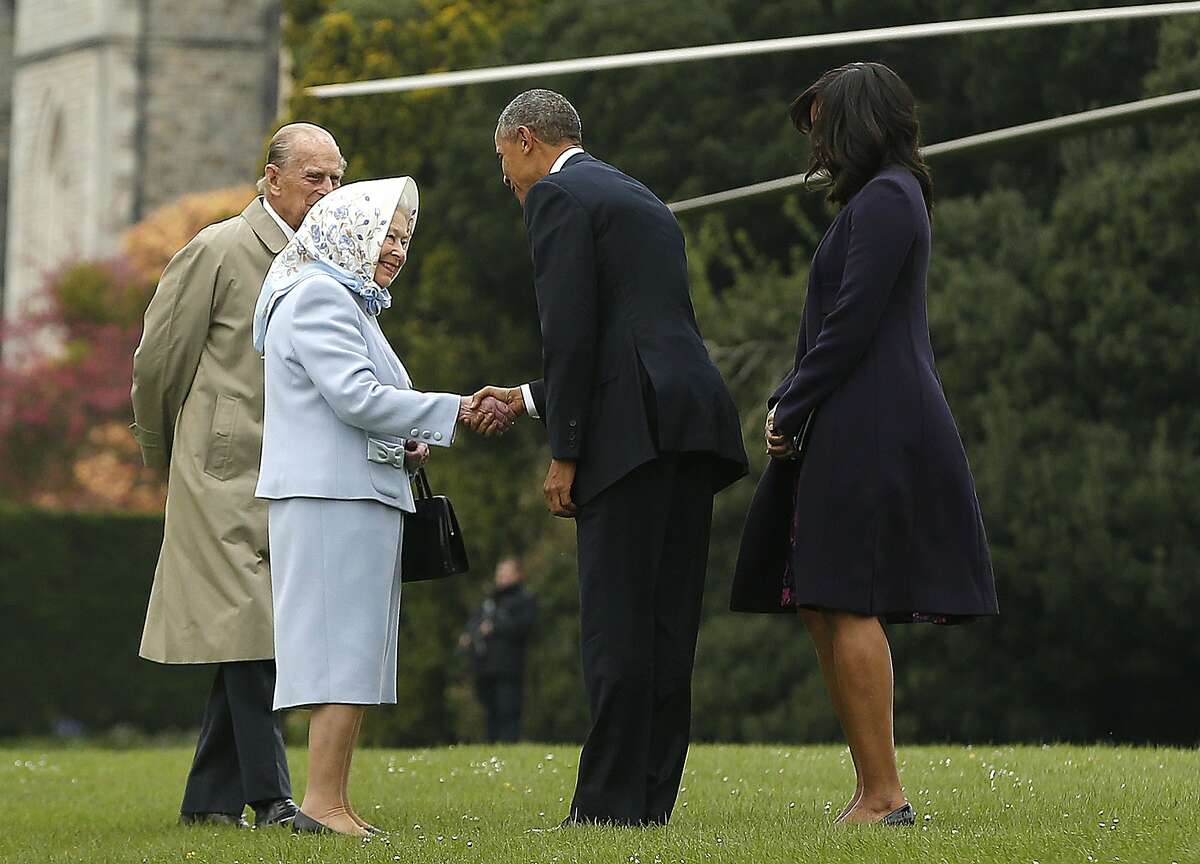 US President Barack Obama (2R) and his wife US First Lady Michelle Obama (R) are greeted by Britain's Queen Elizabeth II (2L) and Prince Philip, Duke of Edinburgh, (L) after landing by helicopter at Windsor Castle for a private lunch in Windsor, southern England, on April, 22, 2016. / AFP PHOTO / POOL / Alastair GrantALASTAIR GRANT/AFP/Getty Images