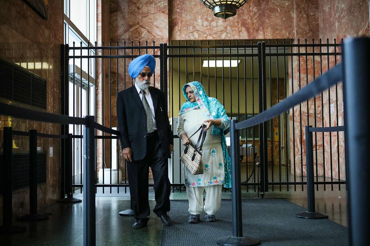 Avtar Chahal (left, blue turban), and Arjinder Chahal, the parents of Gurbaksh Chahal (not pictured), who is a millionaire tech mogul being convicted of domestic abuse, walk into the Hall of Justice, in San Francisco, California, on Friday, April 22, 2016.
