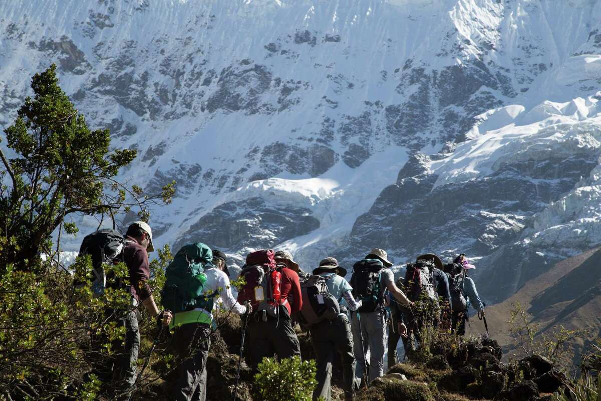 Houston trekkers make their way to Salkantay Pass, the highest point of their trip, at 15,213 feet.