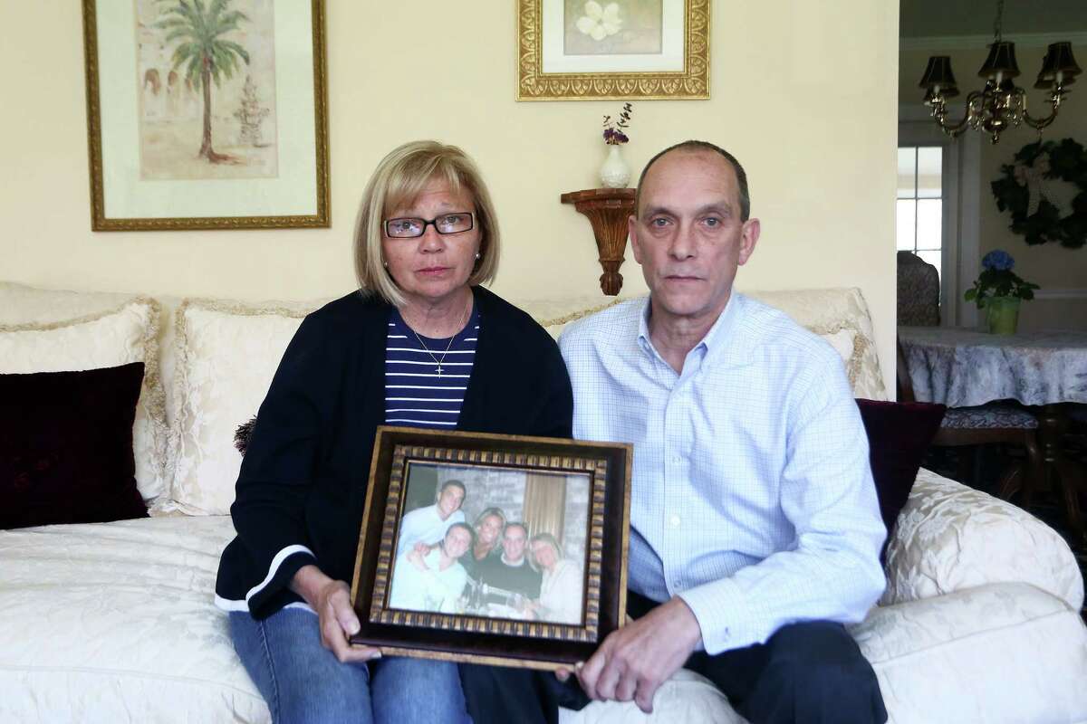 Linda and Richard Pape, parents of the late Dylan Pape, with a family picture at their home. Dylan was killed by SWAT officers at his home on March 21.