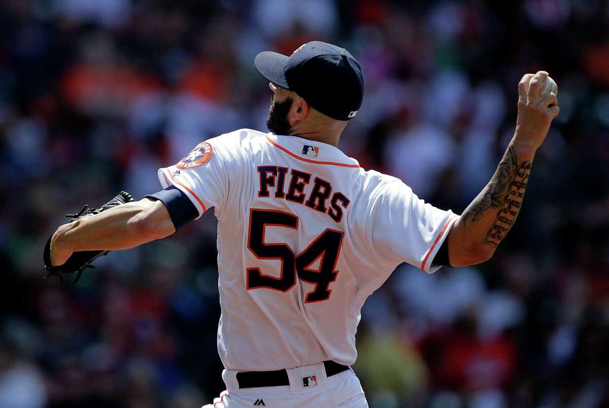 Houston Astros starting pitcher Mike Fiers (54) throws a pitch in the first inning against Boston Red Sox right fielder Mookie Betts (50). Photos of the Houston Astros second game against Boston Red Sox in a three-game series on Saturday, April 23, 2016, in Houston.