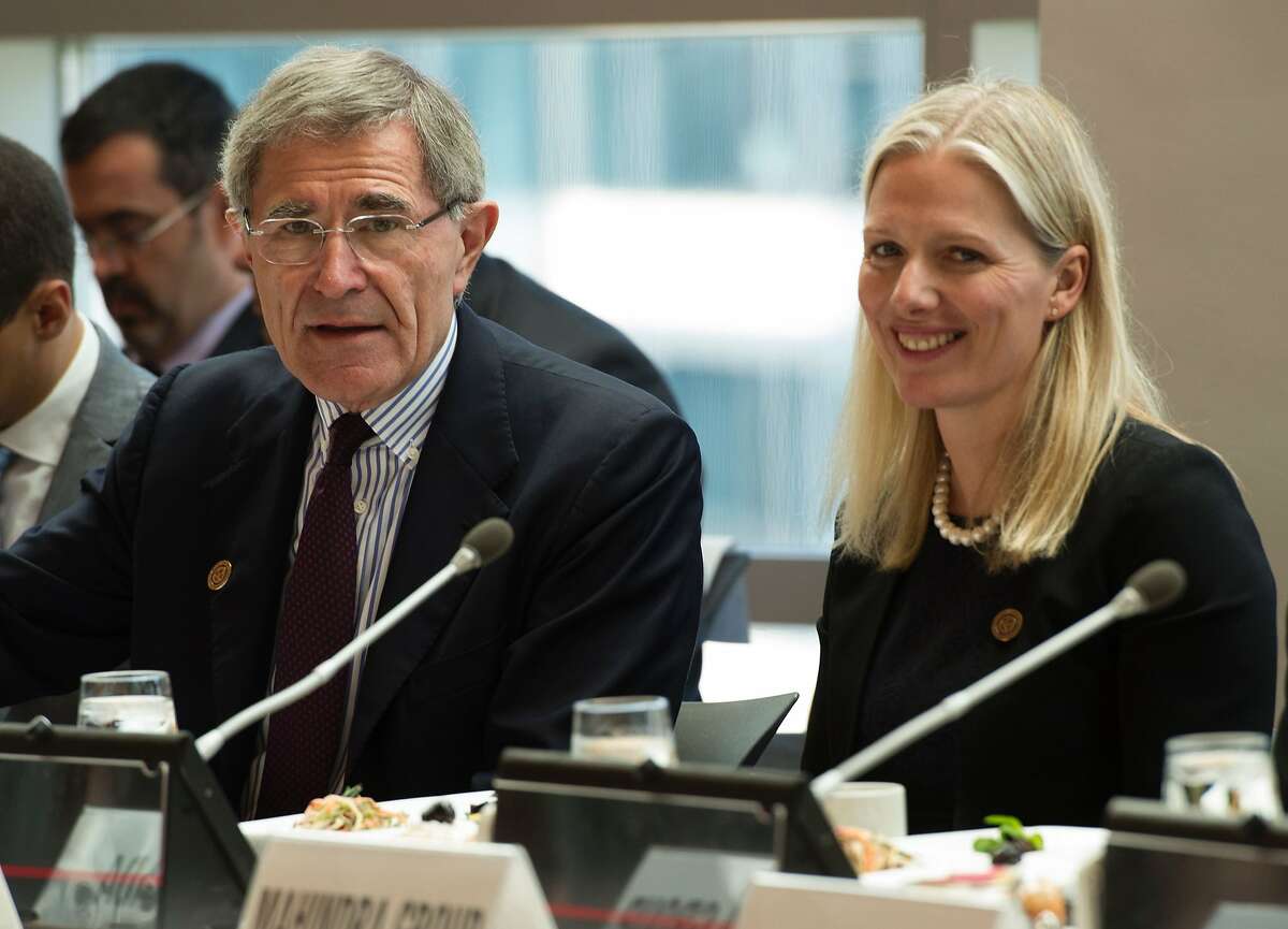 Gerard Mestrallet, Eigne CEO, chats with Catherine McKenna, Minister of Environment and Climate Change, Canada, during the Carbon Pricing Leadership Coalition Assembly during the IMF and World Bank Group 2016 Spring Meetings on April 15, 2016 in Washington, DC. / AFP PHOTO / MOLLY RILEYMOLLY RILEY/AFP/Getty Images