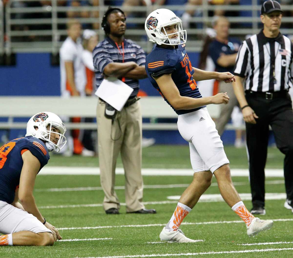 Kicker Daniel Portillo (13) watches the outcome of his field-goal attempt as coach Frank Wilson (second from left) watches during the UTSA spring game at the Alamodome on April 23, 2016.
