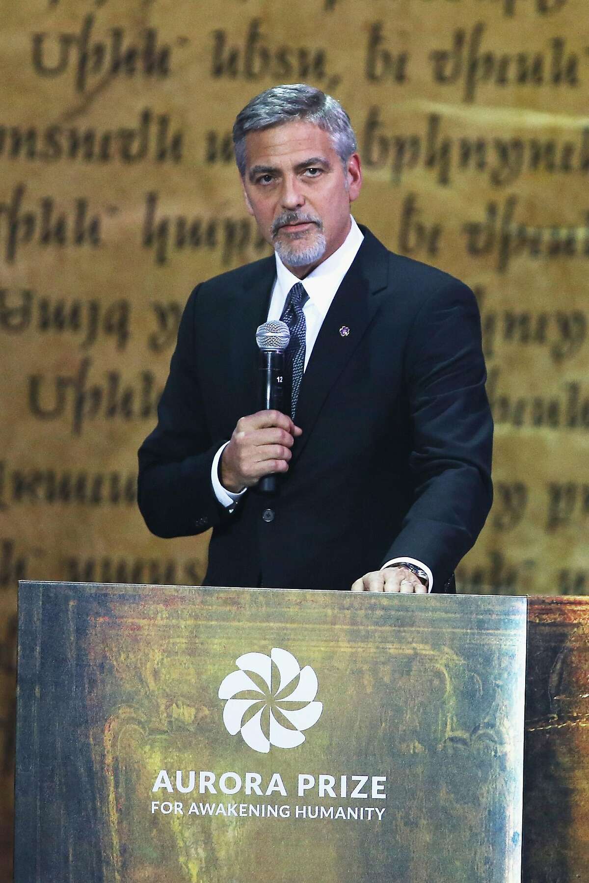 YEREVAN, ARMENIA - APRIL 24: George Clooney, Co-Chair of the Selection Committee, honors Aurora Prize Laureate Marguerite Barankitse and finalists Syeda Ghulam Fatima, Father Bernard Kinvi and Dr. Tom Catena at the Aurora Prize ceremony on April 24, 2016 in Yerevan, Armenia. (Photo by Andreas Rentz/Getty Images for 100 Lives)