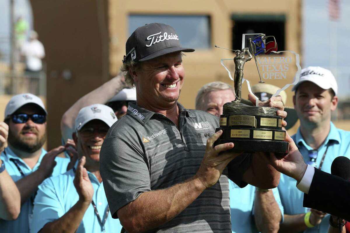Charley Hoffman holds the Valero Texas Open trophy after winning the tournament with a 12-under-par at TPC San Antonio on April 24, 2016.