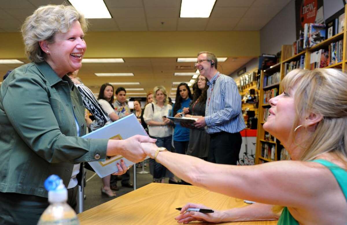 Rosemary Lehman, a sixth grade teacher at Eastern Middle School in Greenwich, meets Kathie Lee Gifford Thursday evening Apr. 15, 2010 during her appearance at the Fairfield Borders store to sign her new children's book "Party Animals."