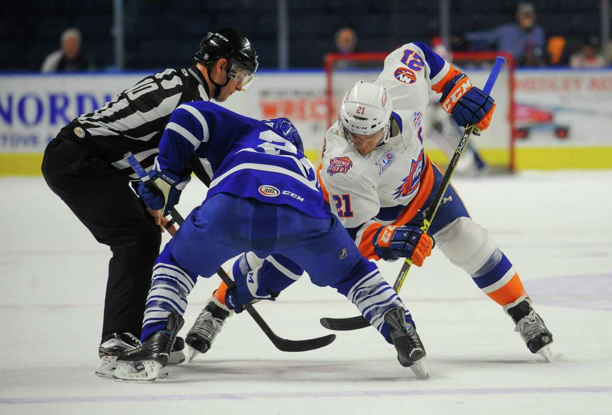 Ben Holstrom (21) of the Bridgeport Sound Tigers faces off during Game 2 of the 2016 Calder Cup Playoffs against the Toronto Marlies at Webster Bank Arena on April 24, 2016 in Bridgeport, Connecticut.