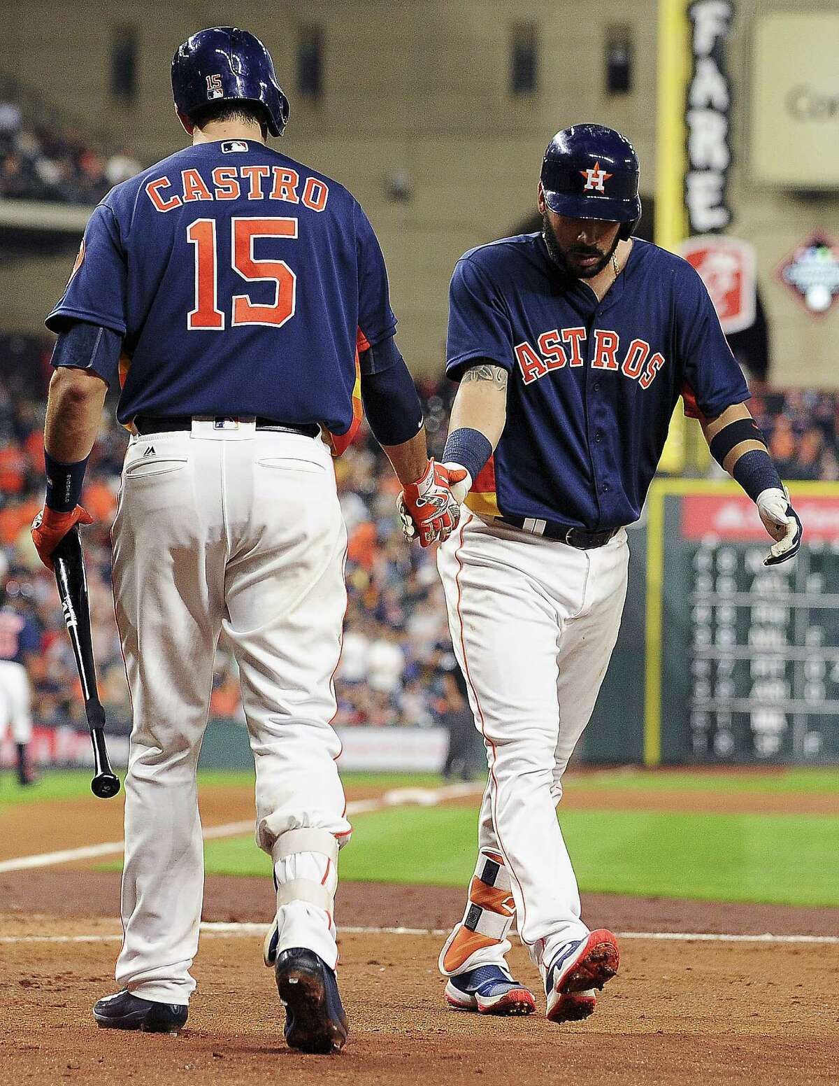 HOUSTON, TX - APRIL 24: Marwin Gonzalez #9 of the Houston Astros celebrates his solo home run with Jason Castro #15 during the second inning against the Boston Red Sox at Minute Maid Park on April 24, 2016 in Houston, Texas.