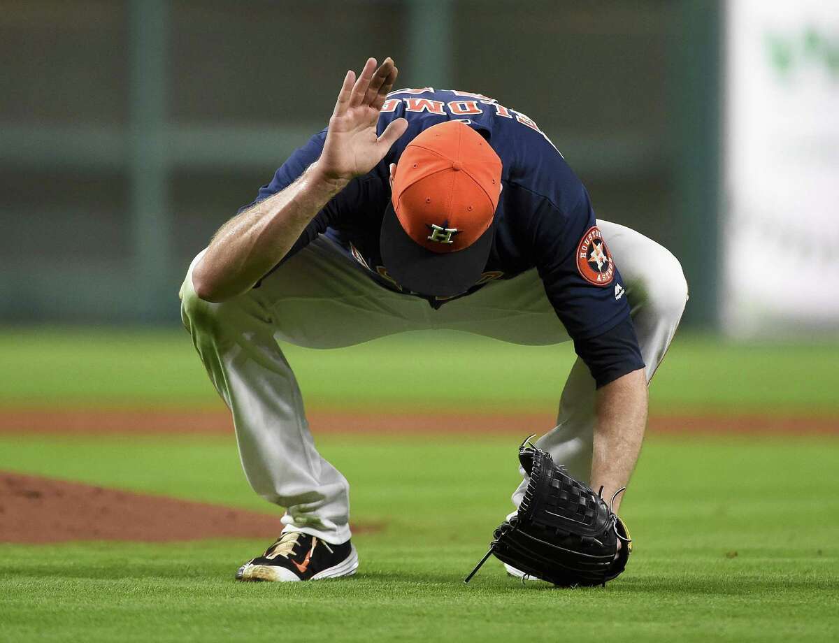 HOUSTON, TX - APRIL 24: Scott Feldman #46 of the Houston Astros reacts after teammate Carlos Correa committed an error with two outs during the third inning against the Boston Red Sox at Minute Maid Park on April 24, 2016 in Houston, Texas.