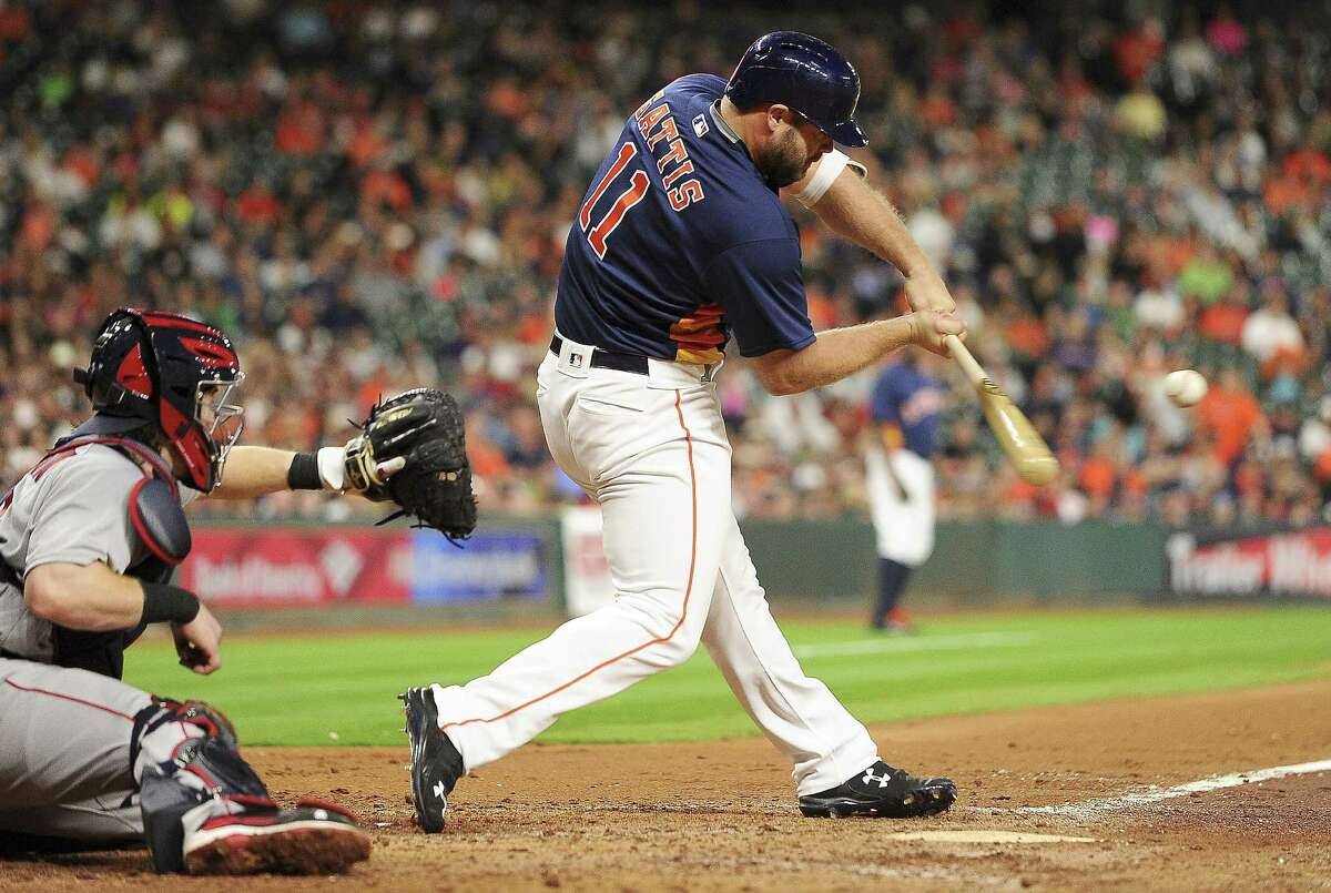HOUSTON, TX - APRIL 24: Evan Gattis #11 of the Houston Astros hits an RBI single during the third inning against the Boston Red Sox at Minute Maid Park on April 24, 2016 in Houston, Texas.