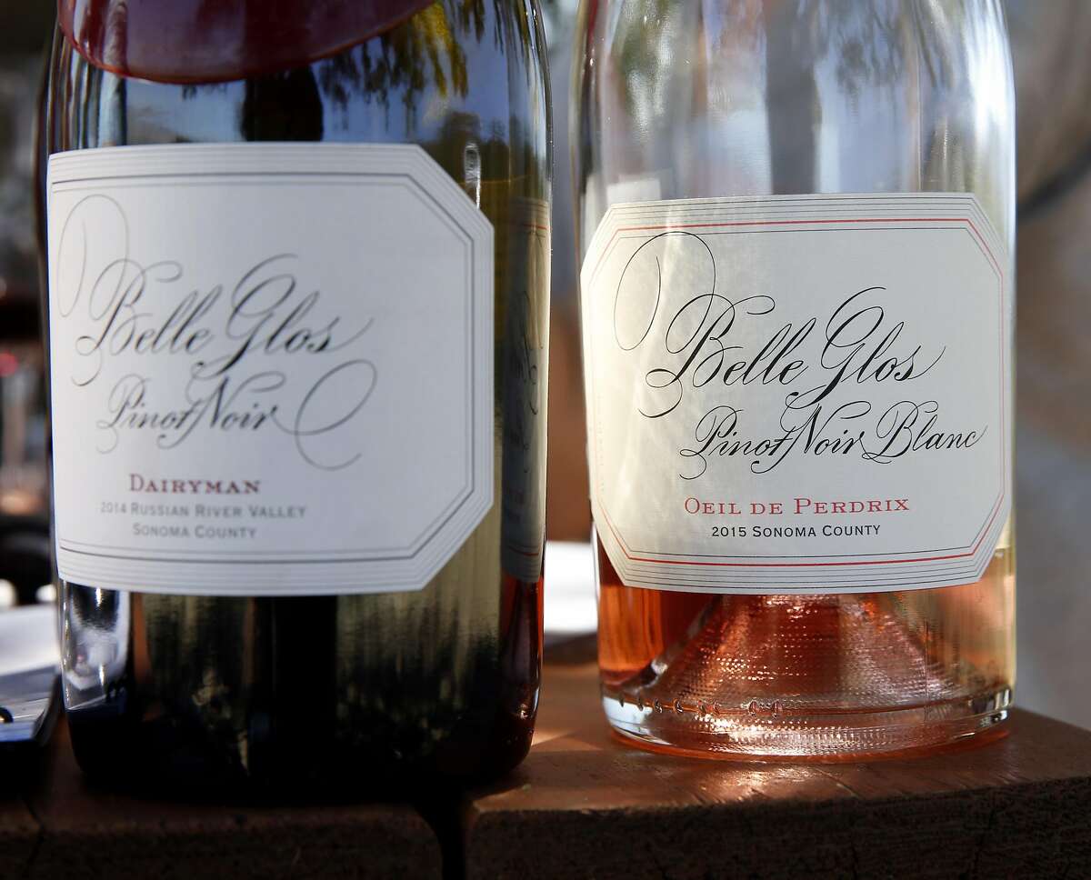 Two bottles of mostly empty Belle Glos wine sit on a picnic table during a tasting in the Las Alturas vineyard at the Santa Lucia Highlands in Monterey County, California, on Monday, April 18, 2016.
