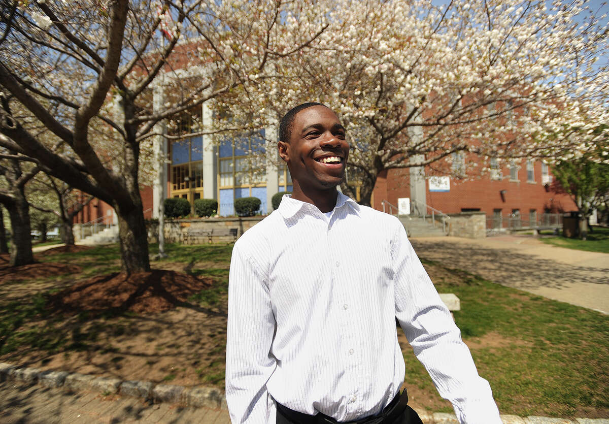 University of Bridgeport freshman Rashawn Powell smiles at friends as he walks on the UB campus.