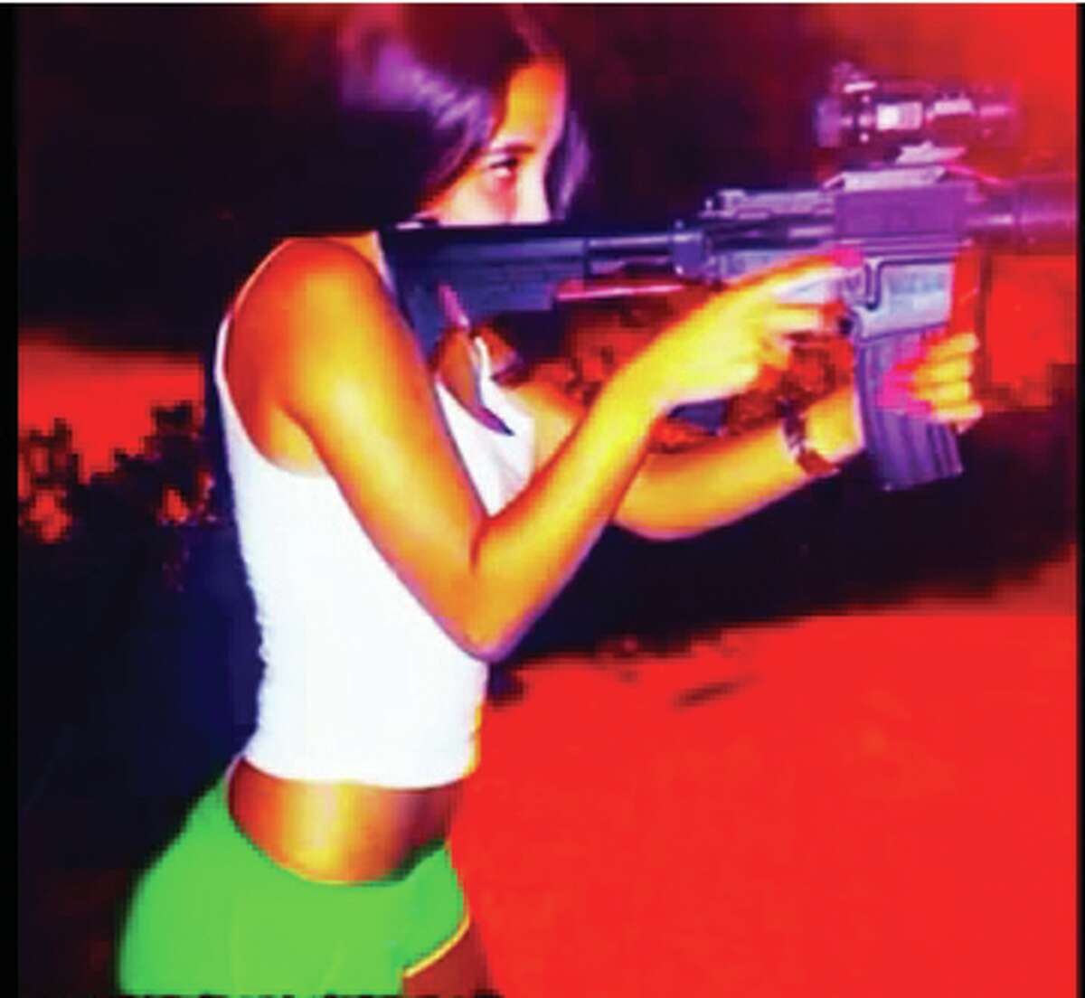 The Mexican outlet El Blog del Narco has published photos purportedly showing women associated with drug cartels posing — some masked, others in various states of undress — with assault rifles, tigers, liquor and trucks.
