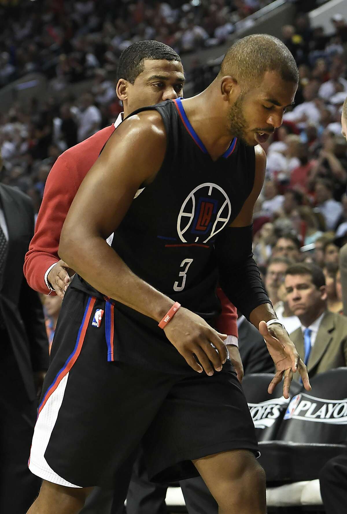 PORTLAND, OR - APRIL 25: Chris Paul #3 of the Los Angeles Clippers walks off the court after he injured his hand in the third quarter of Game Four of the Western Conference Quarterfinals against the Portland Trail Blazers during the 2016 NBA Playoffs at the Moda Center on April 25, 2016 in Portland, Oregon. The Blazers won the game 98-84. NOTE TO USER: User expressly acknowledges and agrees that by downloading and/or using this photograph, user is consenting to the terms and conditions of the Getty Images License Agreement. (Photo by Steve Dykes/Getty Images)