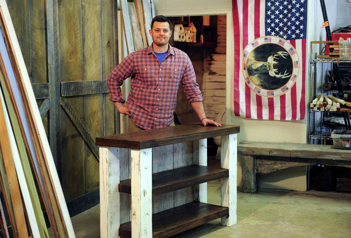 Jared Rohrig, owner of Wood + Grit, poses at his shop on Woodmont Road in Milford, Conn., on Thursday Apr. 14, 2016.
