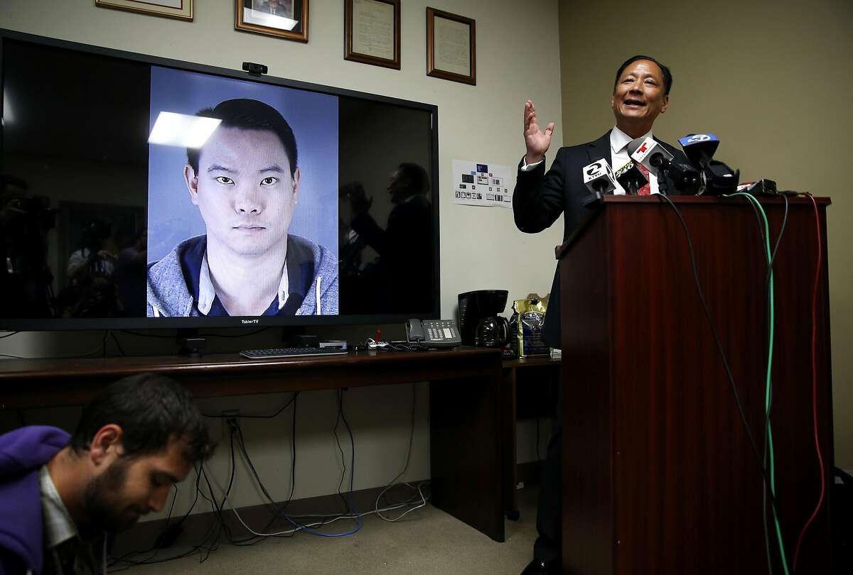 Public Defender Jeff Adachi speaks to journalists about recently uncovered racist text messages sent by San Francisco Police Officer Jason Lai (on screen) during a press conference in San Francisco, California, on Tuesday, April 26, 2016.