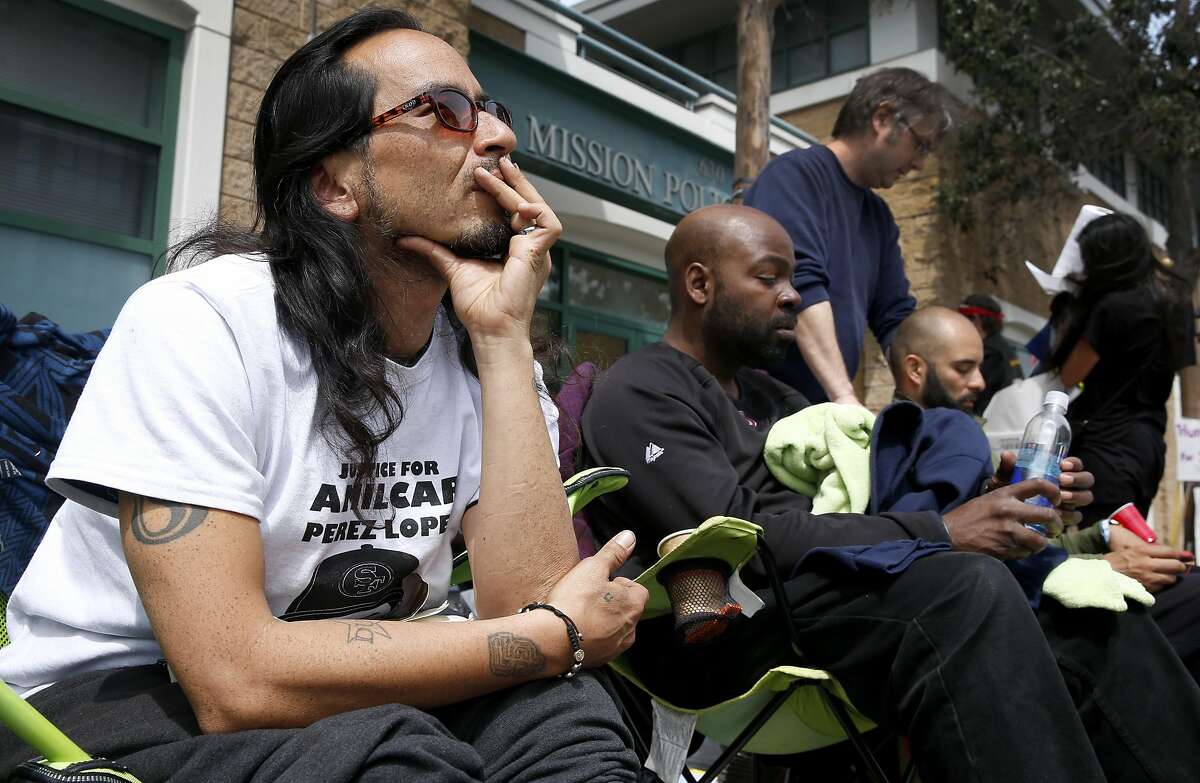 Equipto the rapper (left), Ike Pinkston (center) and Edwin Lindo lead a hunger strike in front of the Mission police station on Valencia Street in San Francisco, Calif. on Tuesday, April 26, 2016. Activists are calling for Chief Greg Suhr to resign after a number of fatal officer involved shootings.