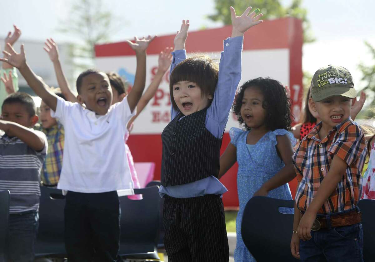 Pre-K 4 SA students sing and dance to will.i.am's What I am during their promotion ceremony at Pre-k 4 SA South in June 2014. Students who have completed the Pre-K 4 SA program were promoted to kindergarten during the ceremony honoring their first education milestone.