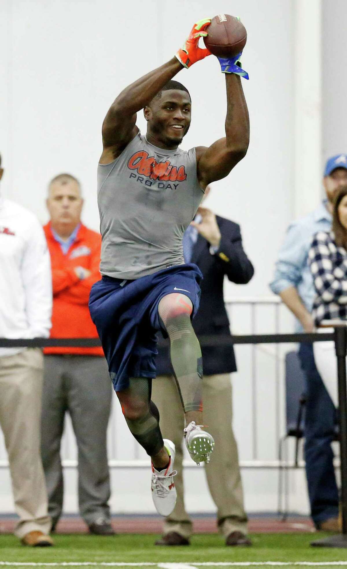Wide receiver Laquon Treadwell reaches for a pass during drills at Mississippi's NFL football Pro Day, Monday, March 28, 2016, in Oxford, Miss. The event is to showcase players for the upcoming NFL football draft. (AP Photo/Rogelio V. Solis)