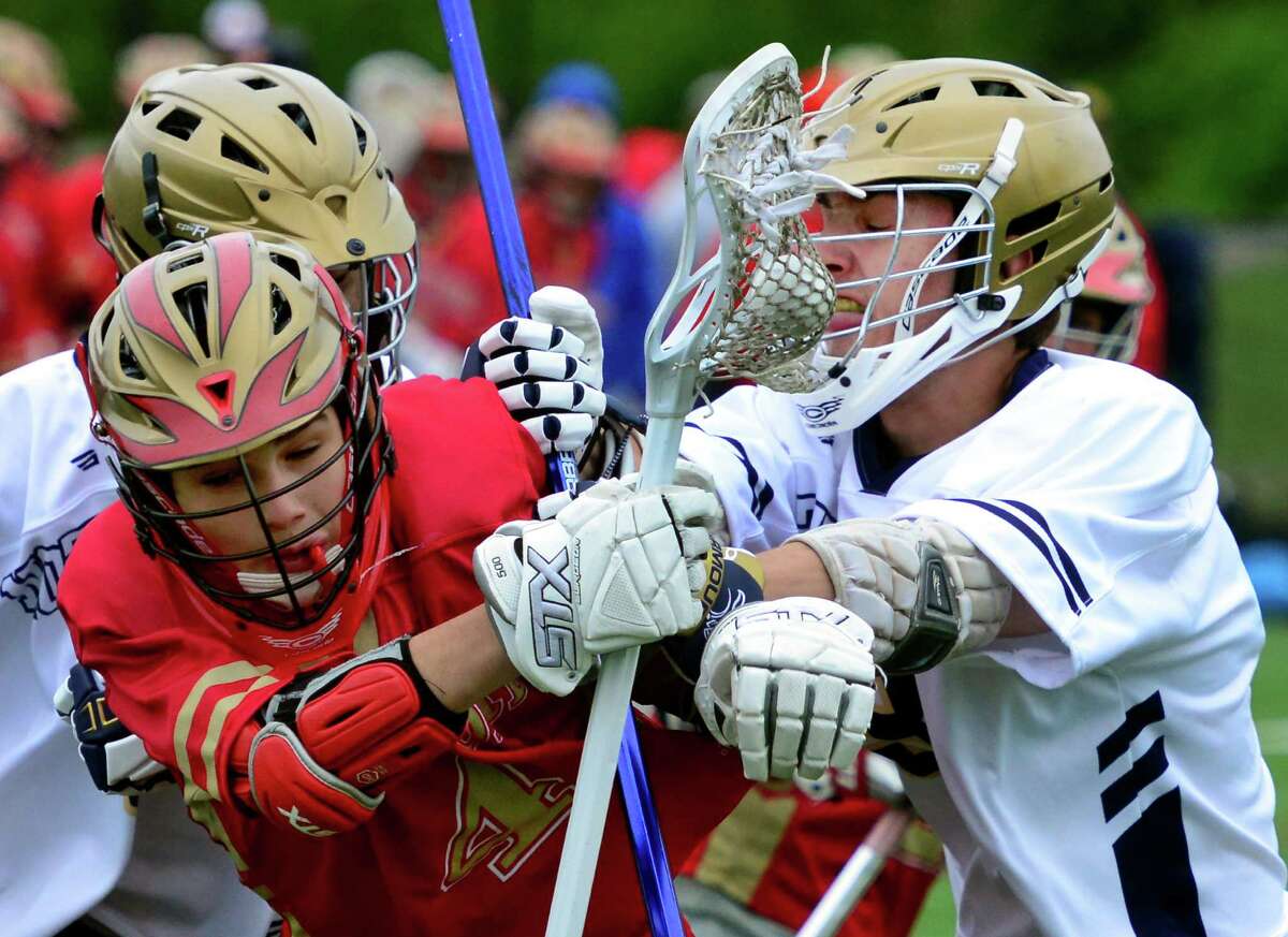 Stratford's Gavin Scofield, left, is shoved by Notre Dame of Fairfield's Michael Toth during boys lacrosse action in Bridgeport, Conn., on Tuesday Apr. 26, 2016.