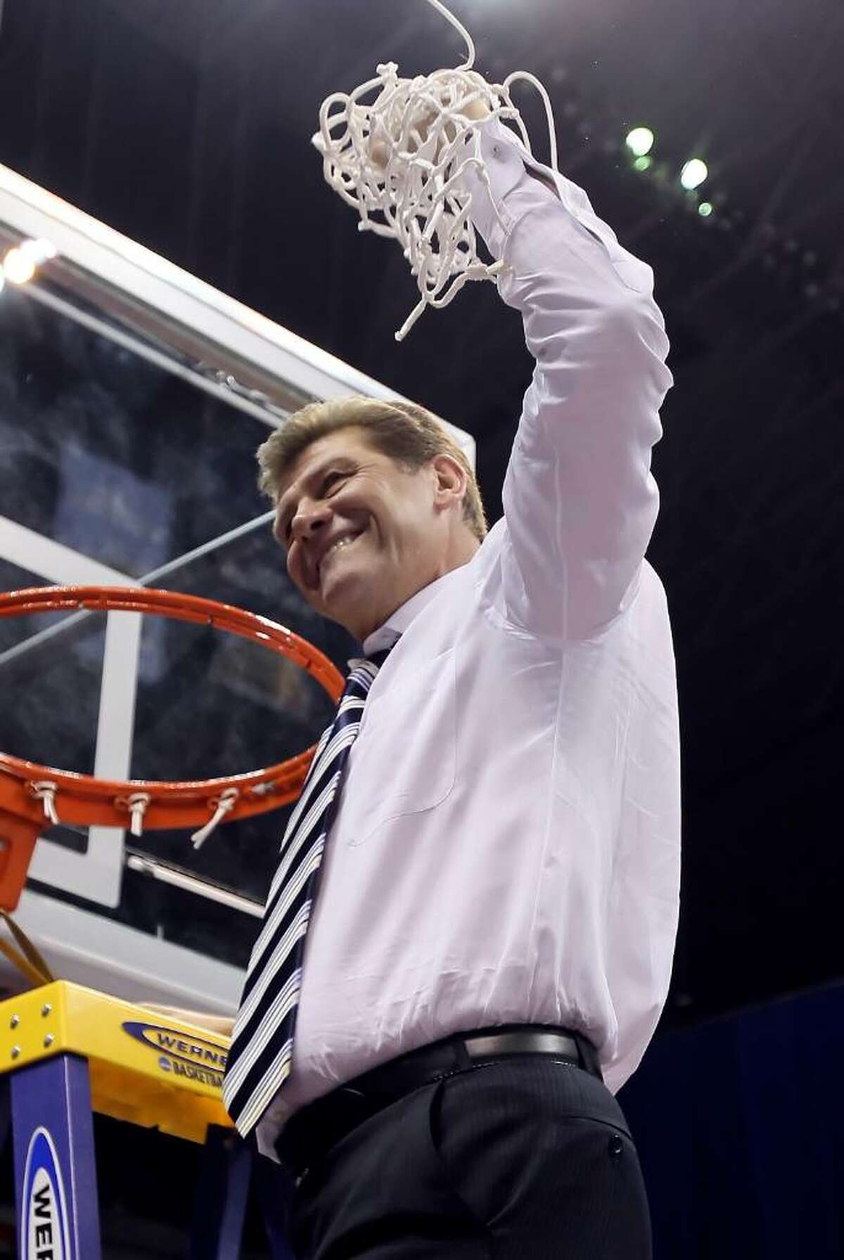 SAN ANTONIO - APRIL 06: Connecticut Huskies head coach Geno Auriemma celebrates his teams 53-47 win over the Stanford Cardinal by cutting down the net following the the NCAA Women's Final Four Championship game at the Alamodome on April 6, 2010 in San Antonio, Texas. (Photo by Jeff Gross/Getty Images) *** Local Caption *** Geno Auriemma