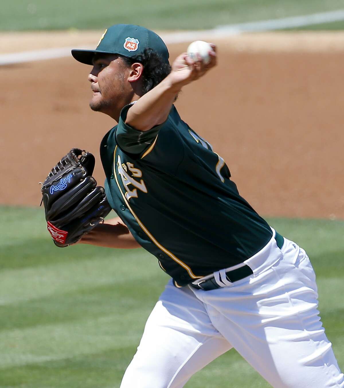 Oakland A's pitcher Sean Manaea throws against the Los Angeles Angels during the first inning of a spring training baseball game, Friday, March 25, 2016, in Mesa, Ariz. (AP Photo/Matt York)