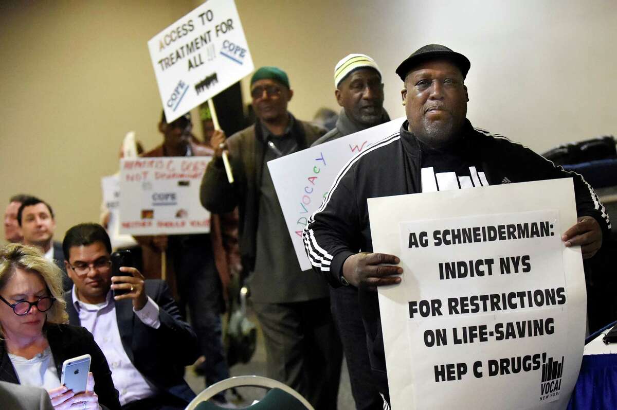 Members of Vocal NY disrupt the state Health Dept.'s Drug Utilization Review Board forum on Wednesday, April 27, 2016, at the Empire State Concourse in Albany, N.Y. Vocal NY demanded that those living with Hepatitis C have unrestricted access to the cure through Medicaid. (Cindy Schultz / Times Union)