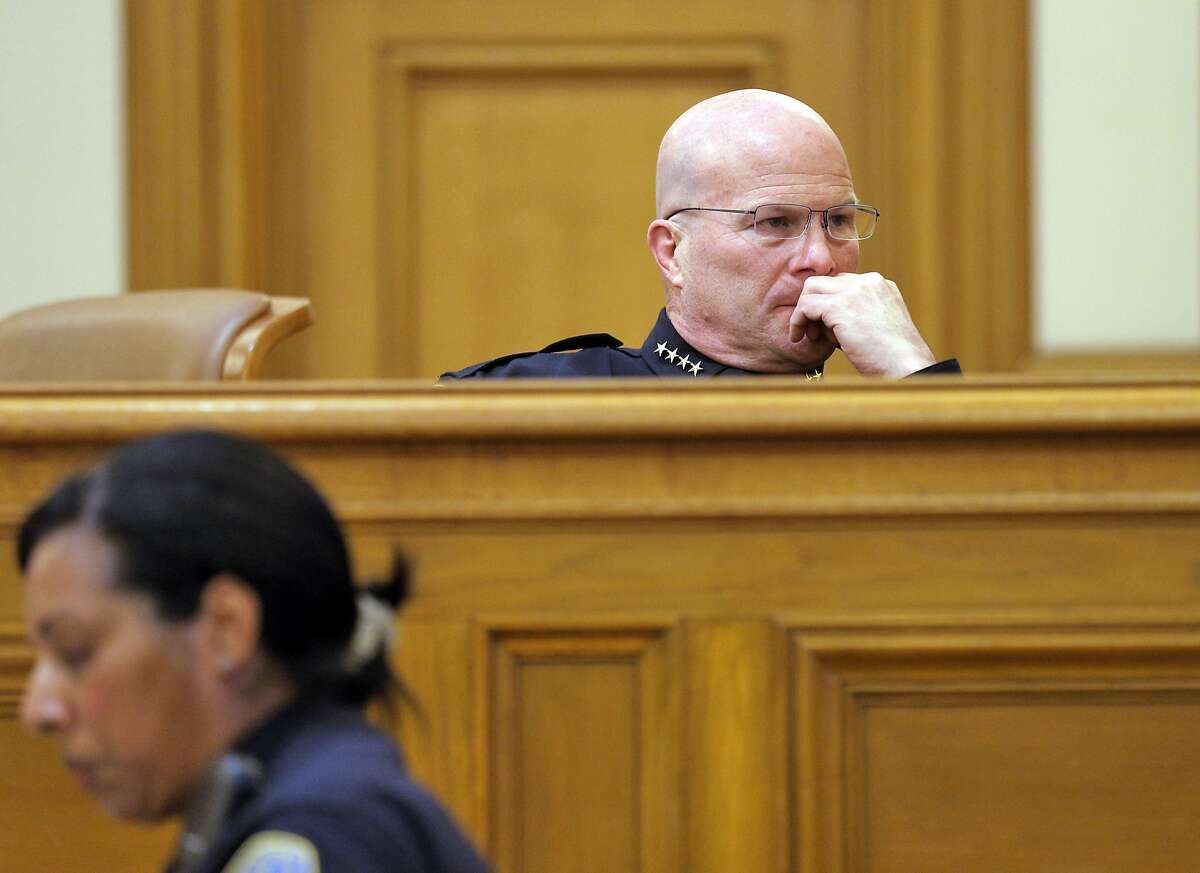 San Francisco Police Chief Greg Suhr looks at a screen during the San Francisco Police Commission meeting on Wednesday, April 8, 2015, in San Francisco, Calif. The fate of several San Francisco Police officers involved in racist and homophobic text messaging was under consideration by the commission in a closed session later in the meeting.