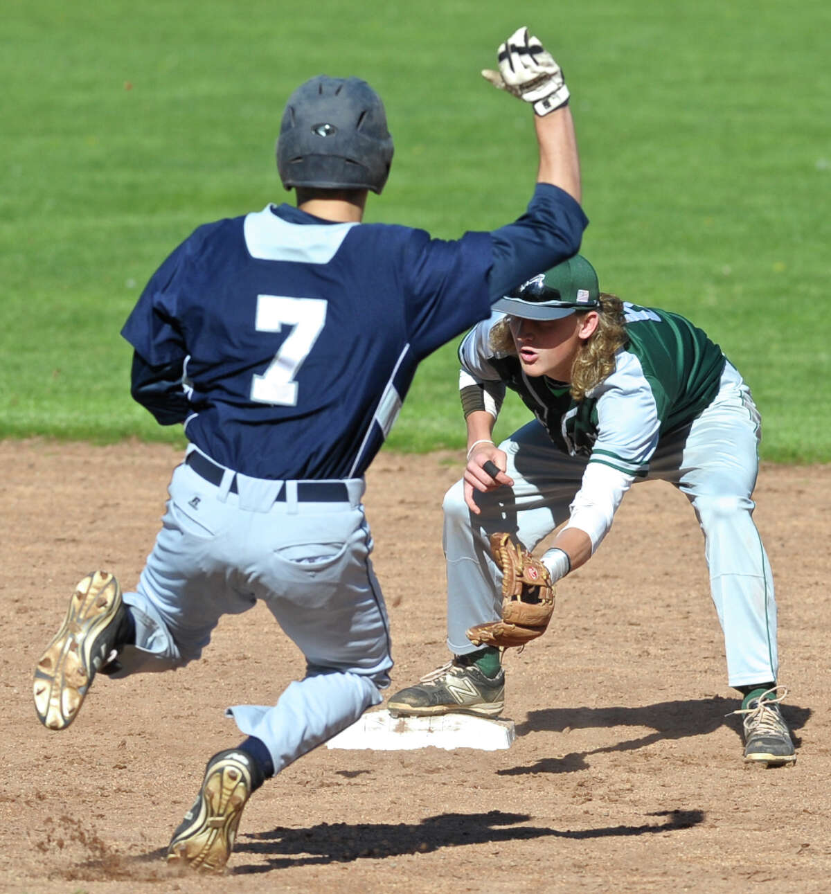 New Milford's Cooper Knight (6) reaches for the ball as Immaculate's James Fahey (7) slides into second in the SWC boys baseball game between New Milford and Immaculate high schools, on Wednesday afternoon, April 27, 2016, at Immaculate High School, in Danbury, Conn. Fahey was out at second.