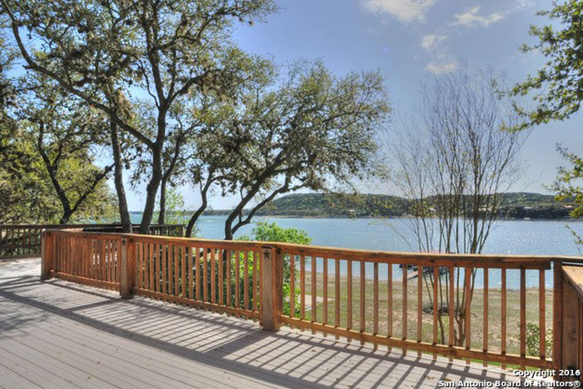 Address: 918 Pebble Beach Drive Area: NW Pipe Creek, TX 78063 This is a beautiful waterfront log home on Medina Lake. The view of the lake out of the living room, dining room or kitchen is worth being here. The amazing layout of the kitchen and all the cabinets with the center island create a great entertainment atmosphere. It is all one level to enter and inside, but there is a back staircase to walk down to the lake. The open floor plan is a pure pleasure. There are numerous porches, decks and options for places to be outside and enjoy the lake. Janet Springer | Coldwell Banker D'Ann Harper | jspringer@cbharper.com | 830.816.2211
