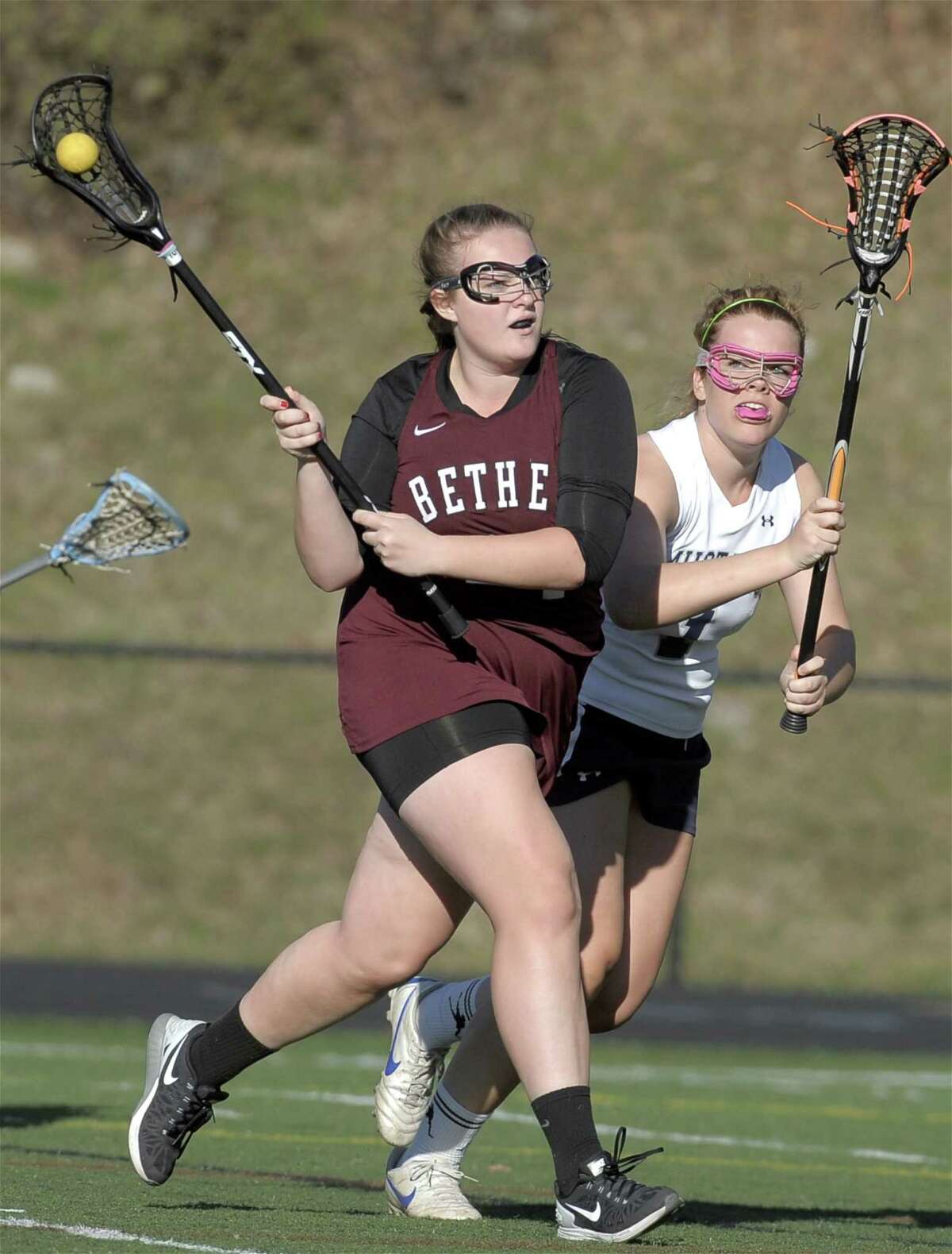 FILE PHOTO: Bethel's Sarah Melvin (24) heads towards the goal while being defended by Immaculate's Brianna Sullivan (1) in the girls high school lacrosse game between Bethel and Immaculate high schools on Tuesday, April 28, 2015, played at Immaculate High School, in Danbury, Conn.