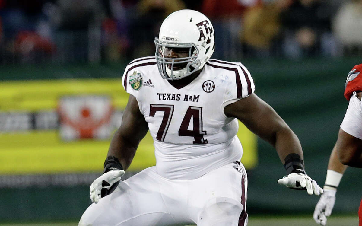 Texas A&M offensive lineman Germain Ifedi plays against Louisville in the second half of the Music City Bowl on Dec. 30, 2015, in Nashville, Tenn.