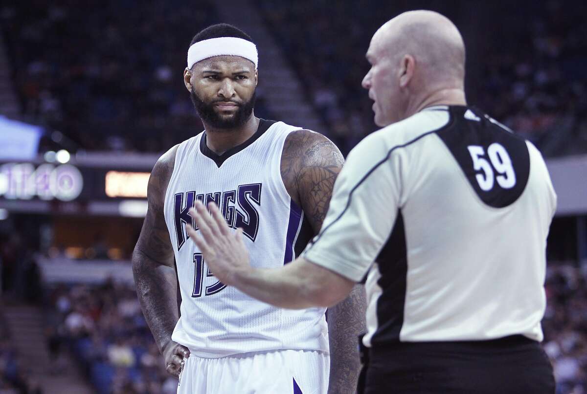 Sacramento Kings center DeMarcus Cousins chats with official Gary Zielinski during the second half of an NBA basketball game against the Dallas Mavericks in Sacramento, Calif., Sunday, March. 27, 2016. The Kings won 133-111. (AP Photo/Steve Yeater)