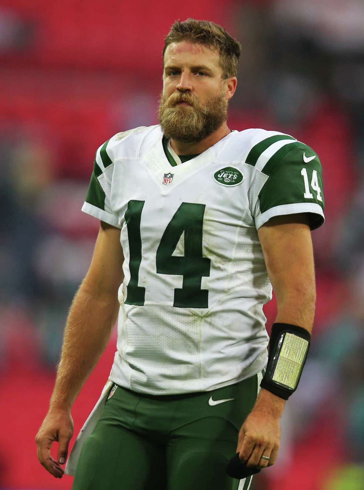 New York Jets quarterback Ryan Fitzpatrick talks to reporters after an NFL  football game against the