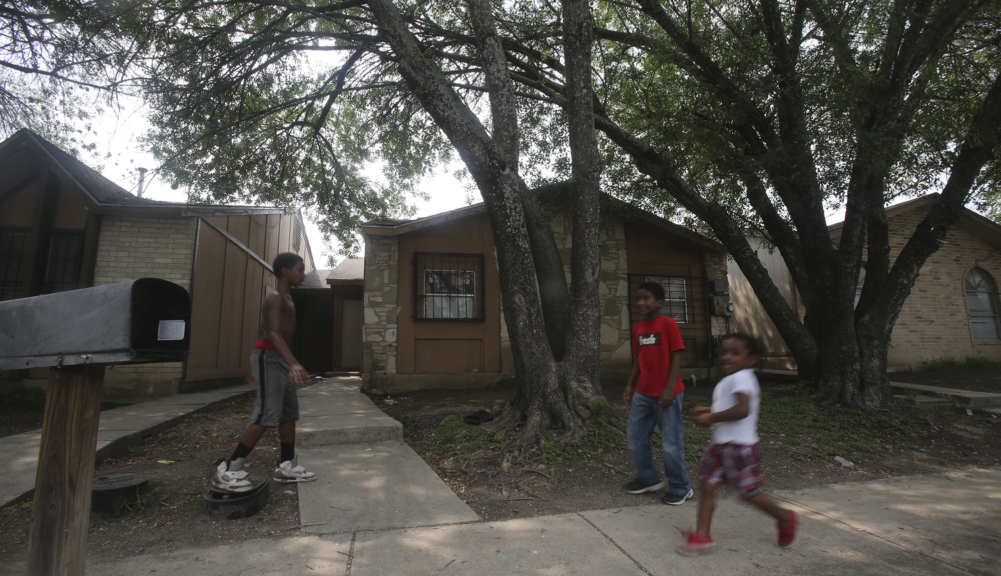 Mother charged after children found unattended in home, chained in backyard