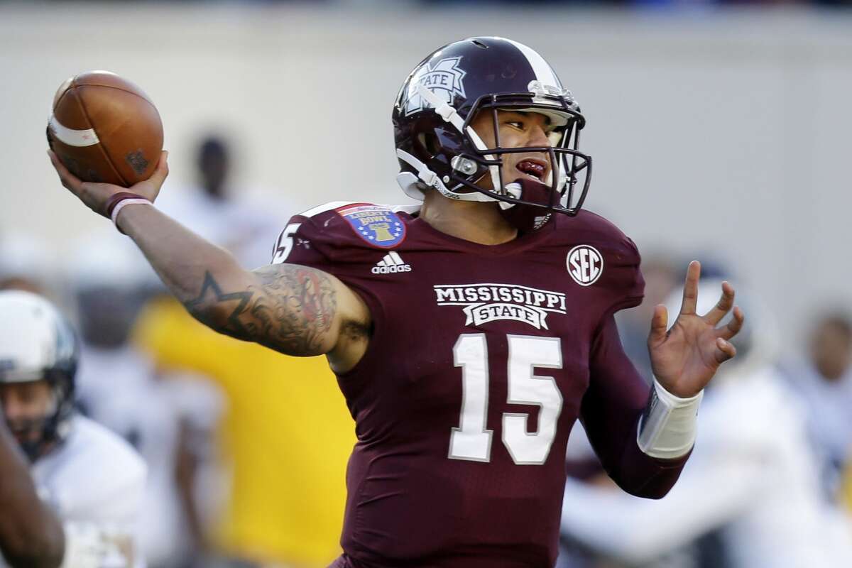 Mississippi State quarterback Dak Prescott passes against Rice in the first quarter of the Liberty Bowl NCAA college football game on Tuesday, Dec. 31, 2013, in Memphis, Tenn. (AP Photo/Mark Humphrey)
