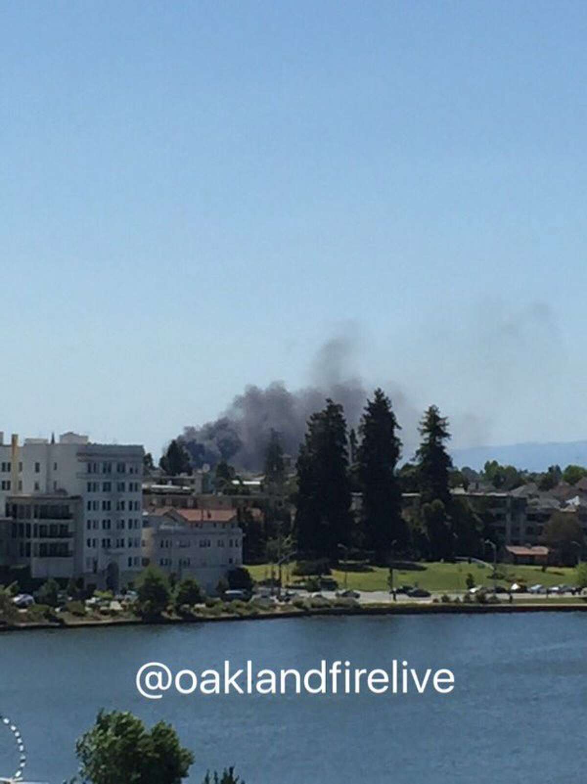 A fire burning on a pier in Oakland sent a large plume of smoke over the East Bay the afternoon of Saturday, April 30, 2016.