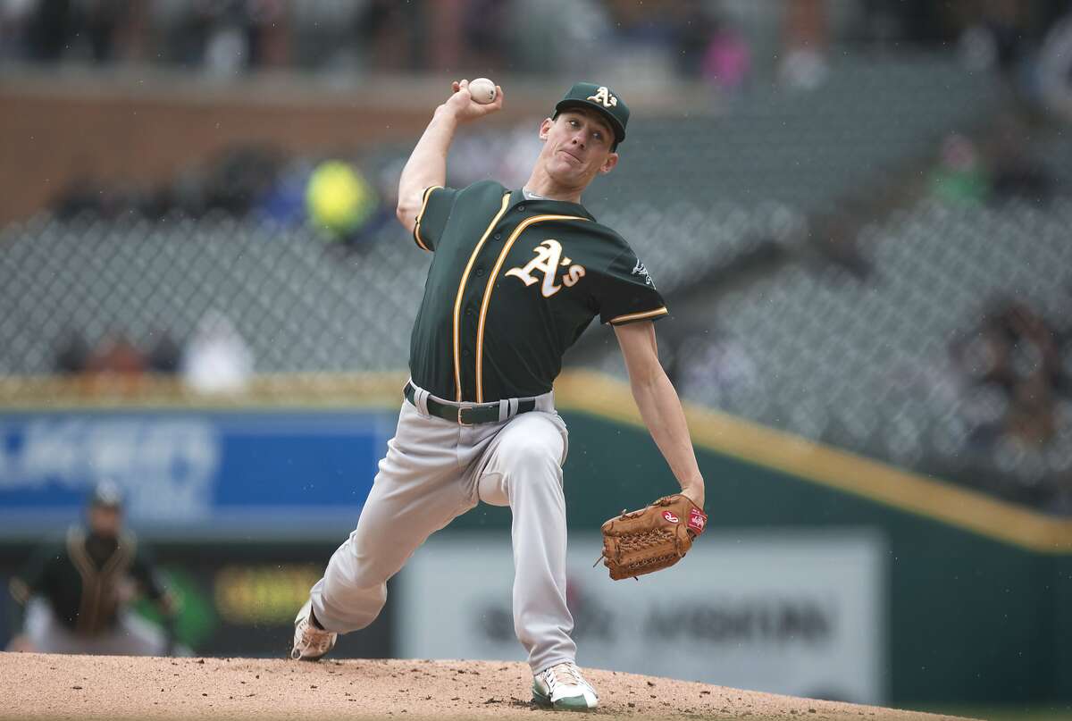 Oakland Athletics pitcher Chris Bassitt throws against the Detroit Tigers in the first inning of a baseball game in Detroit, Thursday, April 28, 2016. (AP Photo/Paul Sancya)