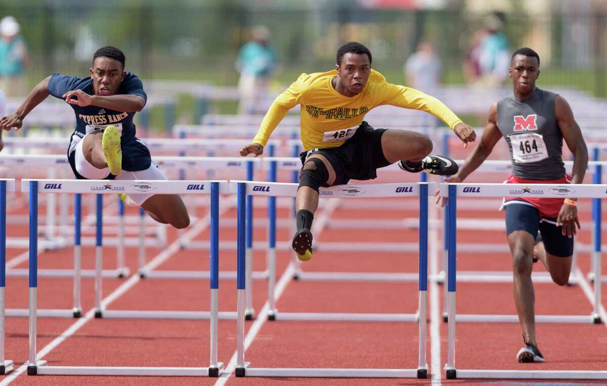 Cypress Falls' Tyler Guillory, center at left, won the boys' 110-meter hurdles at the Class 6A Region III track and field meet Saturday at Clear Creek ISD's Challenger Columbia Stadium. Meanwhile. Cypress Springs' Sierra Smith, right, won the girls' 200-meter dash.