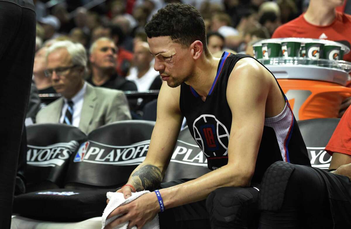 PORTLAND, OR - APRIL 29: Austin Rivers #25 of the Los Angeles Clippers sits on the bench as time runs down in the fourth quarter of Game Six of the Western Conference Quarterfinals against the Portland Trail Blazers during the 2016 NBA Playoffs at the Moda Center on April 29, 2016 in Portland, Oregon. The Blazers won 106-103. NOTE TO USER: User expressly acknowledges and agrees that by downloading and/or using this photograph, user is consenting to the terms and conditions of the Getty Images License Agreement. (Photo by Steve Dykes/Getty Images)