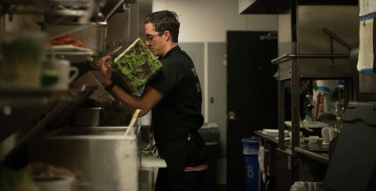 HOLD FOR STORY BY KEVIN BURBACH TO MOVE SUN. MAY 1, 2016 - In this April 30, 2016 photo, chef Ray Roberts, who owns four Peoples Organic restaurants in the Twin Cities, prepares meals at his Edina, Minn., location. Roberts was the personal chef for music megastar Prince until he was found dead on April 21, 2016. He said in recent months Prince had been battling waves of sore throats and stomach aches and didnÂ?’t seem like himself. (Kevin Burbach/AP)