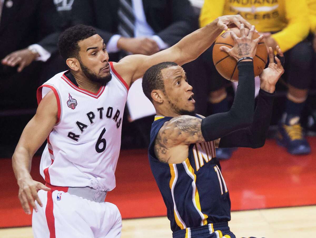 The Raptors' Cory Joseph swoops in from behind to stop a drive by the Pacers' Monta Ellis.
