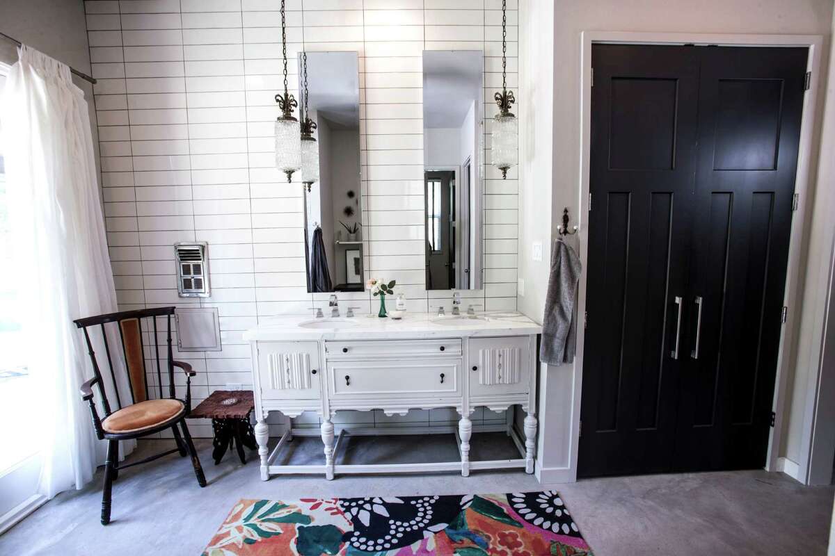 ON TREND: Turning old furniture into new fixtures is one of our favorite trends of the year. This master bath lavatory is an antique buffet painted white and topped with Calacatta Gold marble.See the rest of the home on houstonchronicle.com: Houston designer creates her dream home in country