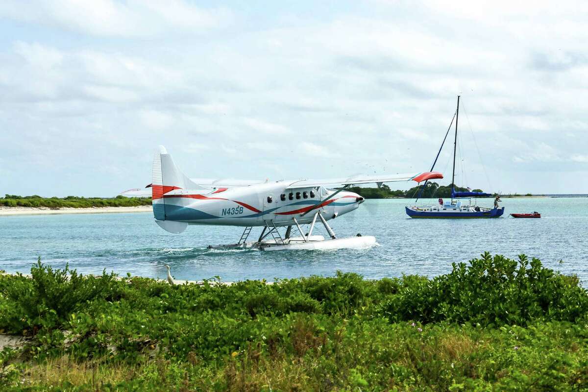 Pilot Gary Bouchard performs a water takeoff in a Key West Seaplane Charters de Havilland DHC-3 Turbine Otter Amphibian from the beachfront on Garden Key, the largest of the seven coral atolls known as the Dry Tortugas.