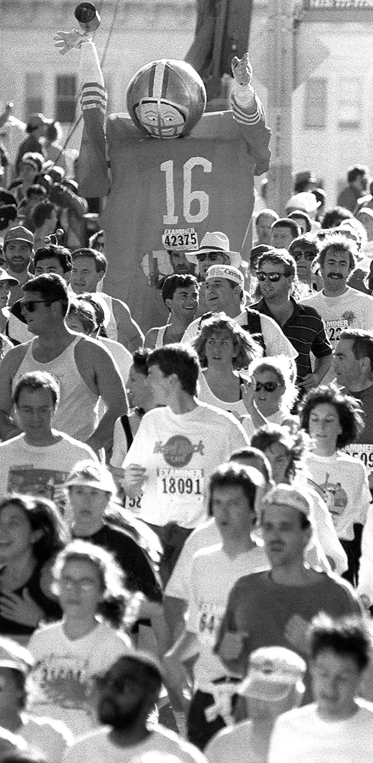 San Francisco Bay to Breakers...can't let go of Joe Montana seen running the Hayes Street hill, May 16, 1993.