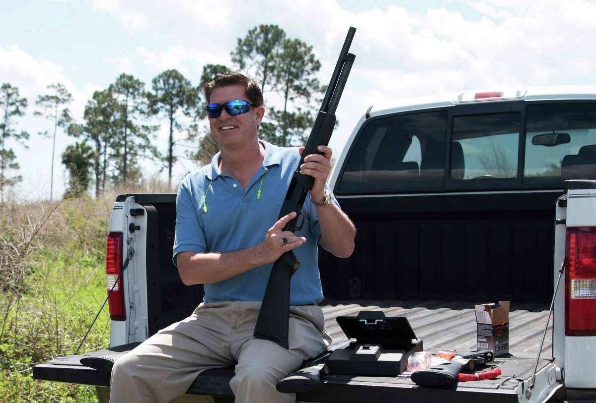 HFM TBA**Jonathan Mossberg, whose iGun Technology Corp. is working to develop a "smart gun," poses with the firearm, Thursday, April 7, 2016, in Daytona Beach, Florida. The firearm uses a ring to send a signal to prevent anyone but an authorized user from firing the weapon. (AP Photo/Lisa Marie Pane)