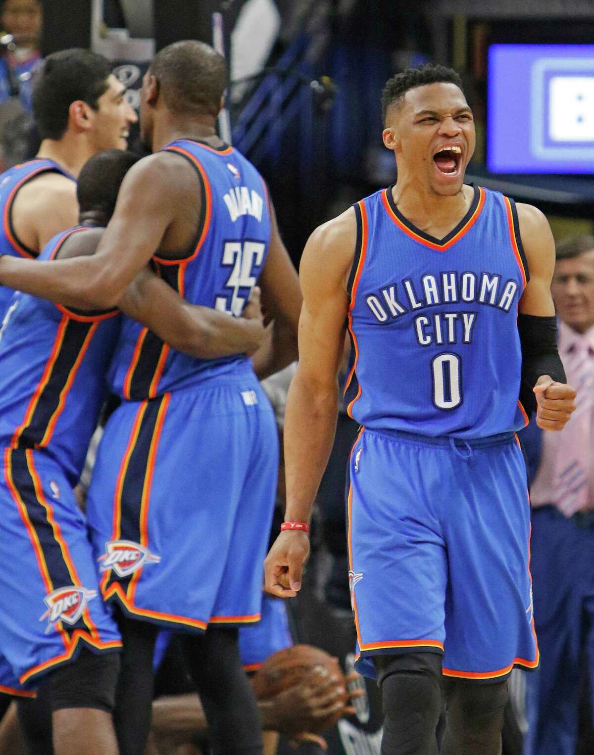 Call it a Thunderclap. Russell Westbrook, right, leads the celebration after Oklahoma City beat the Spurs at the AT&T Center in San Antonio on Monday.﻿